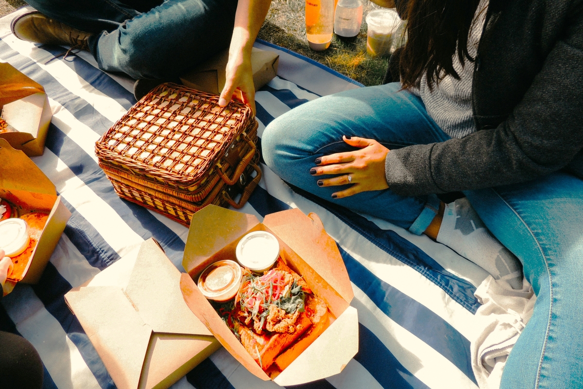 where to buy food near parks in london - sharing a picnic with friends